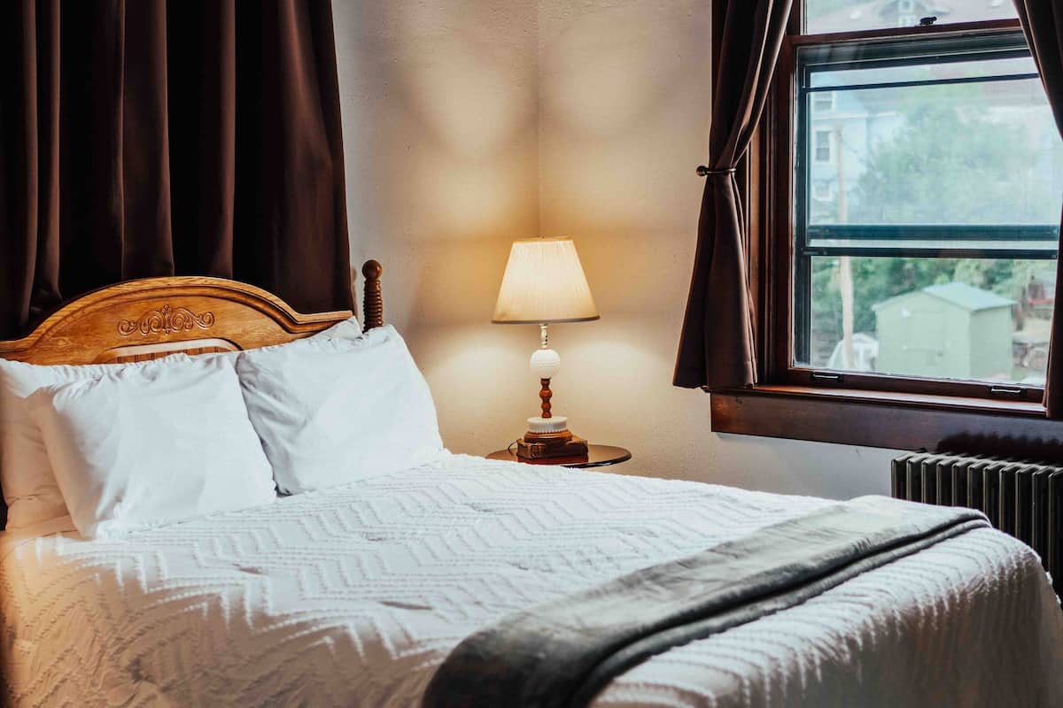 Suite, 1 Queen Bed (Deliberation) | Individually decorated, individually furnished, blackout drapes