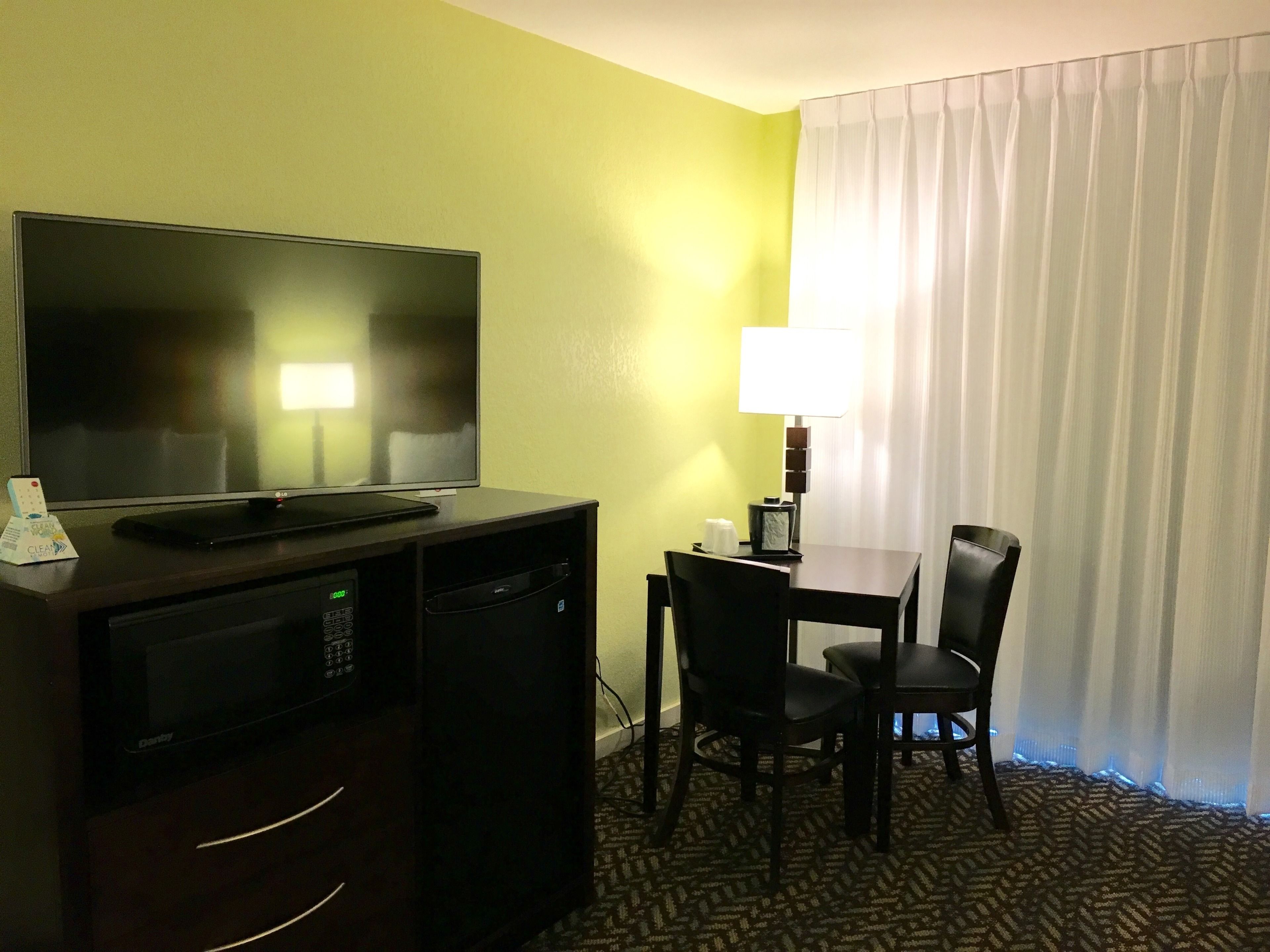 premium bedding, desk, blackout curtains, iron/ironing board