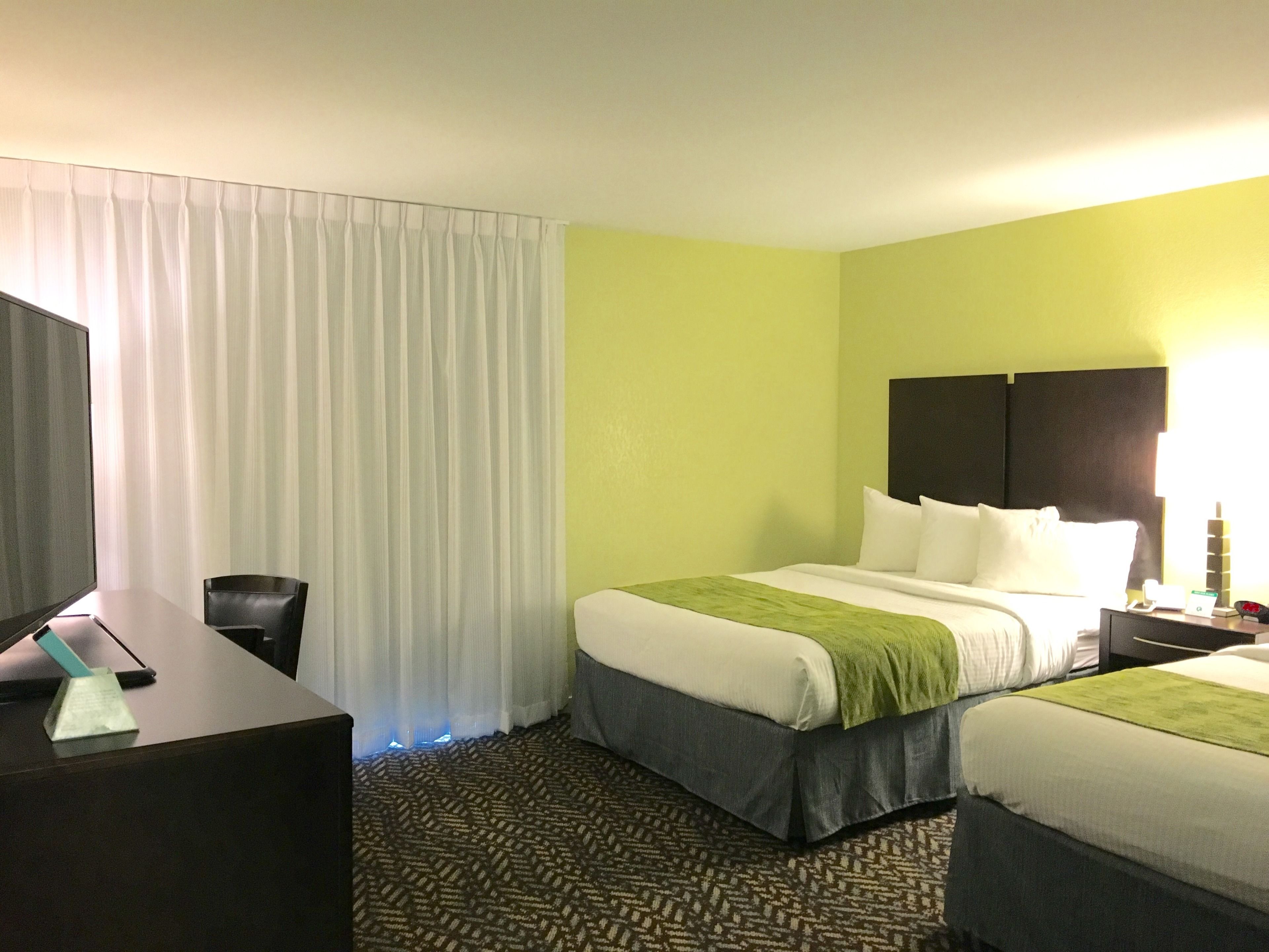 premium bedding, desk, blackout curtains, iron/ironing board