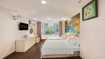 Family Triple Room | Minibar, in-room safe, iron/ironing board, free WiFi