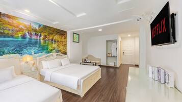 Family Triple Room | Minibar, in-room safe, iron/ironing board, free WiFi