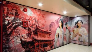 A wall with a traditional Chinese architectural painting, a red emergency button, and a glass panel. - Hotel Sogo Kalentong Marketplace (Mandaluyong)