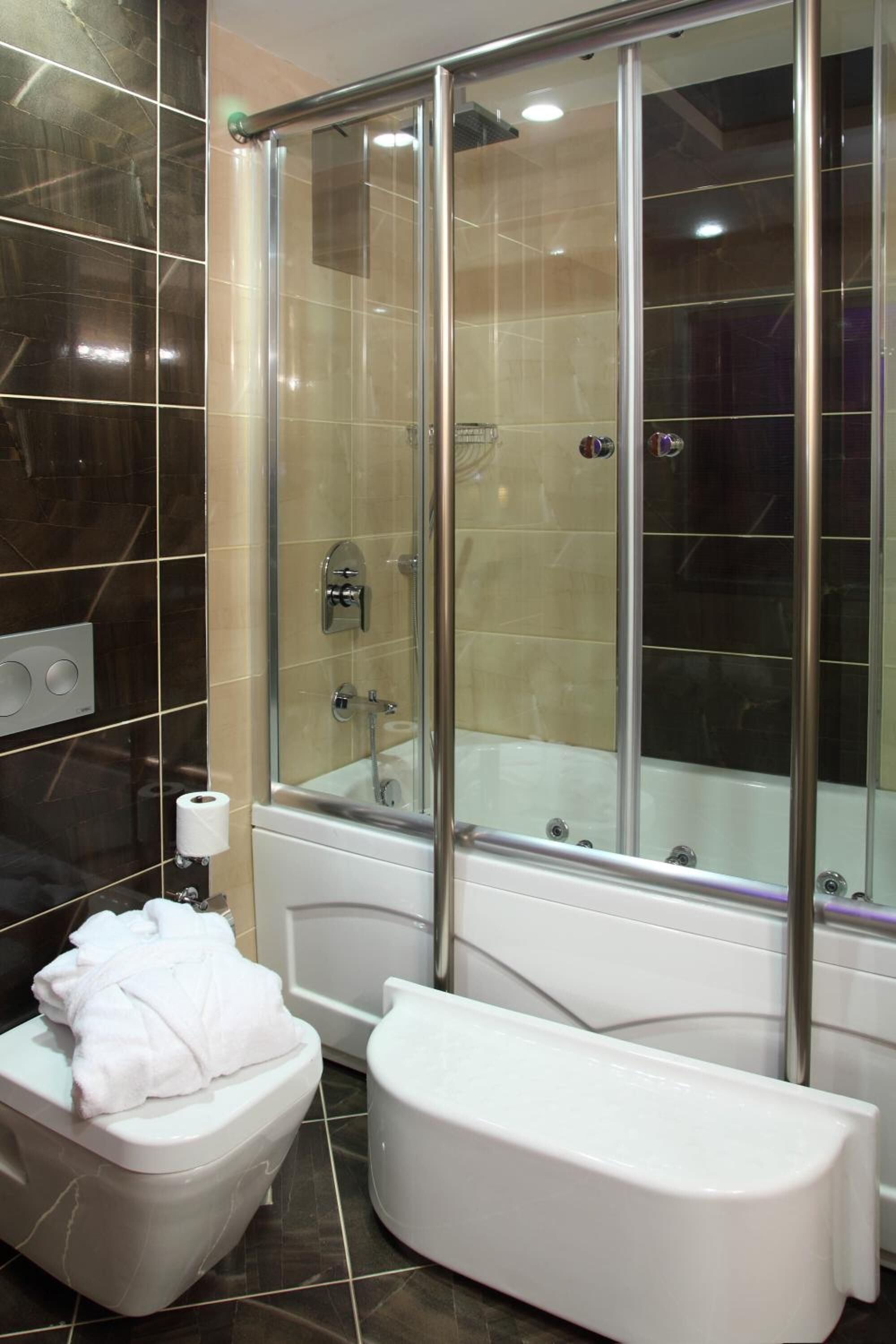 combined shower/bathtub, free toiletries, hair dryer, bathrobes