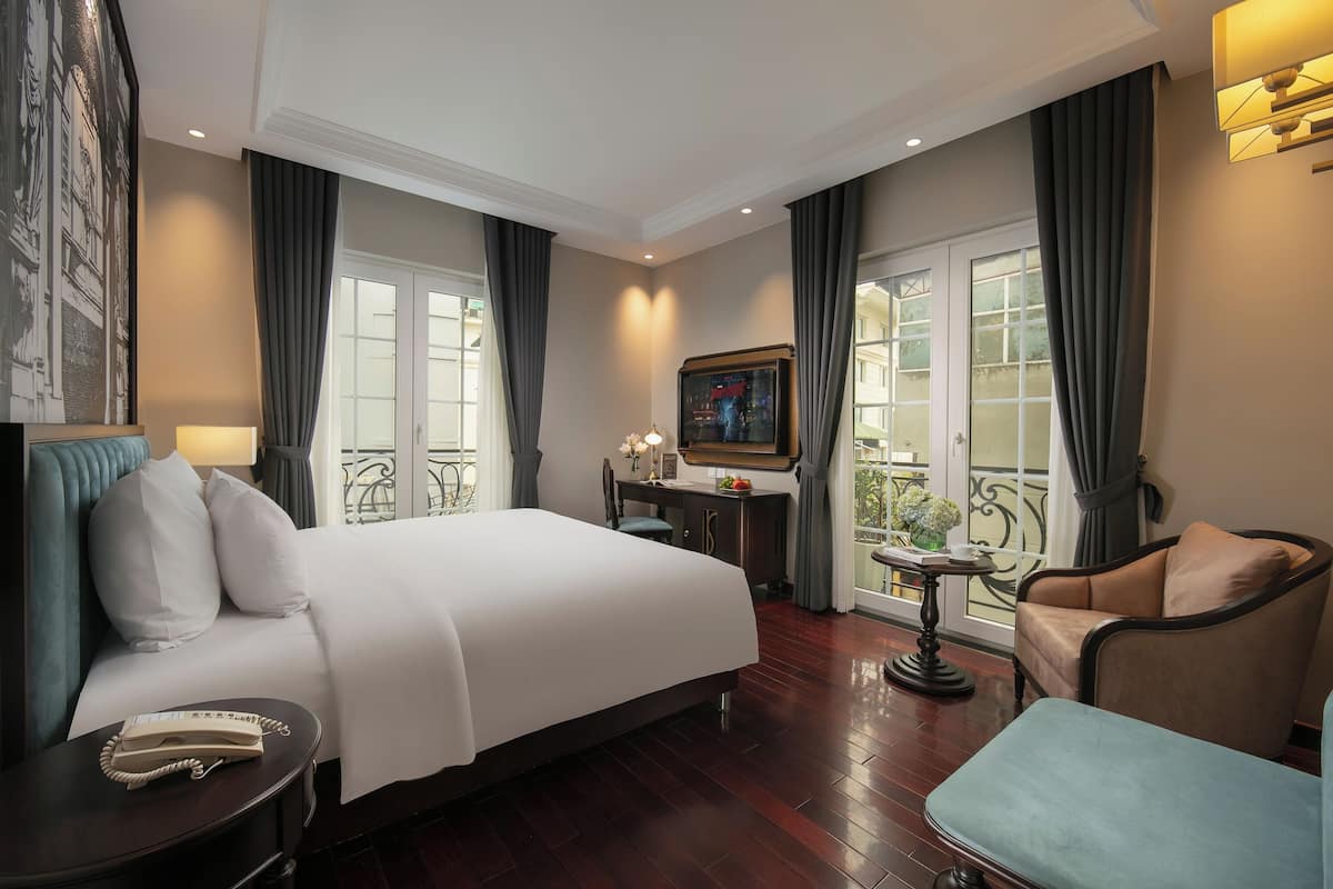 Honeymoon Double Room, City View | Living area | 32-inch flat-screen TV with cable channels, TV