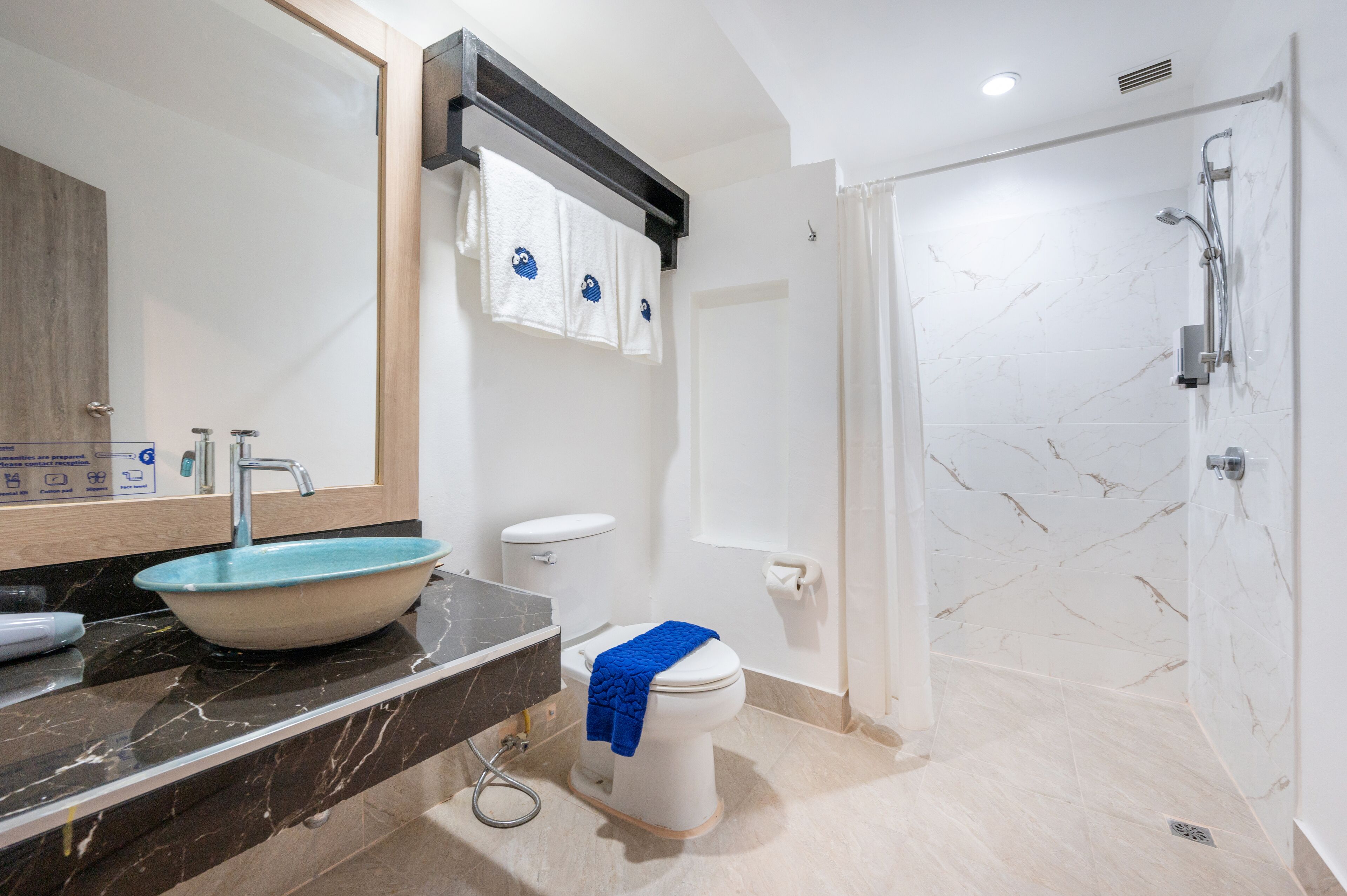 deluxe triple room | bathroom | shower, free toiletries, hair dryer, towels