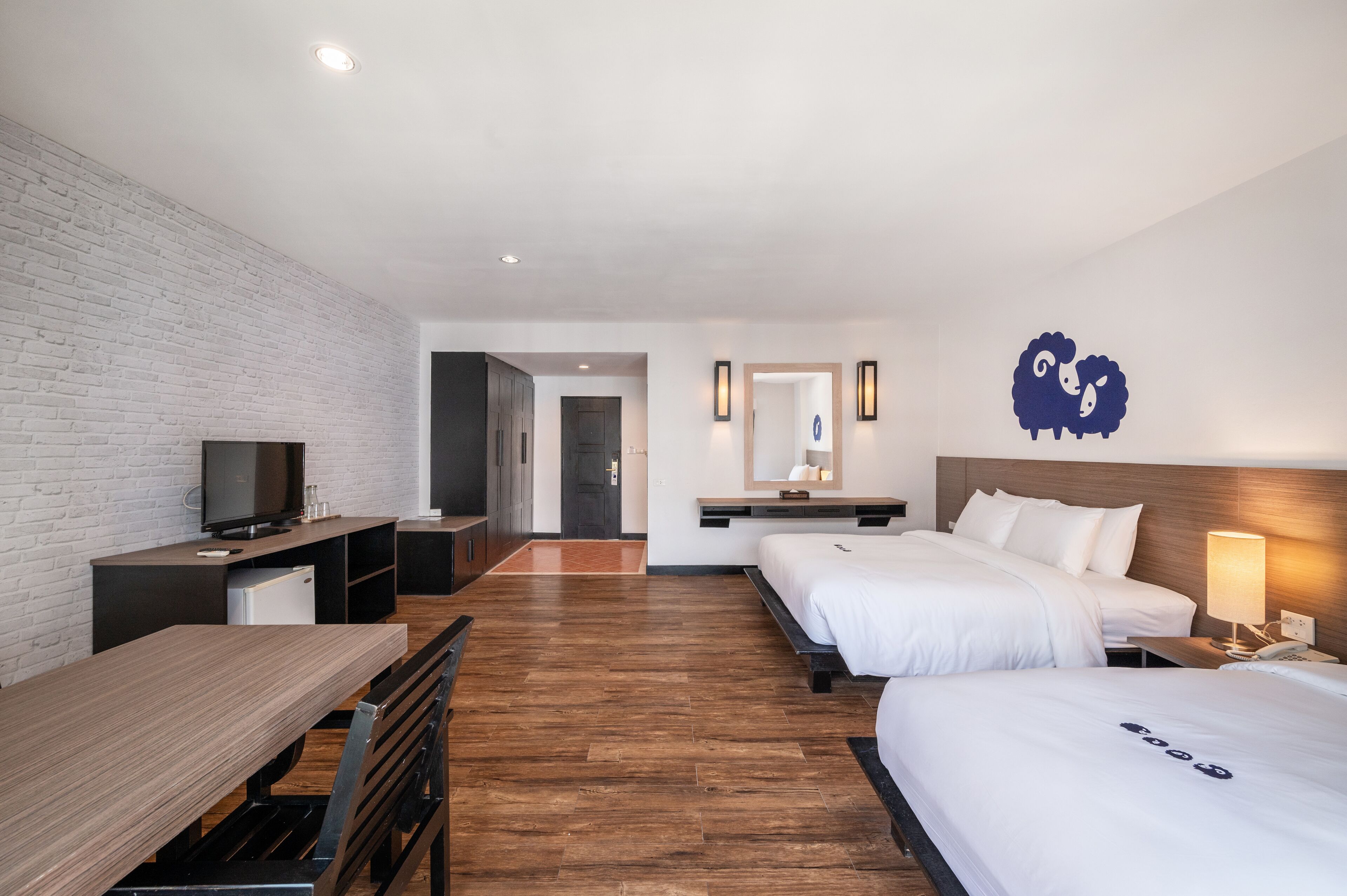 deluxe triple room | in-room safe, desk, blackout curtains, free wifi