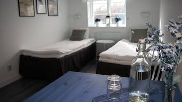 Twin Room, 2 Twin Beds, Shared Bathroom | Individually decorated, laptop workspace, blackout drapes, travel crib
