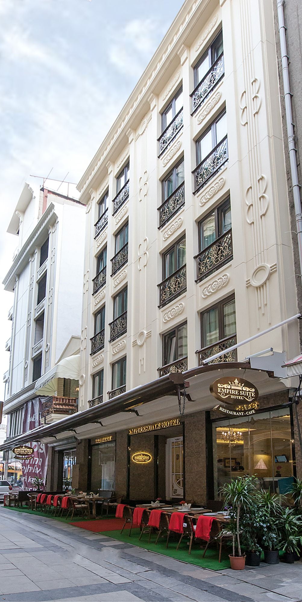 The exterior of the Empire Suite Hotel with a restaurant-cafe on the ground floor.