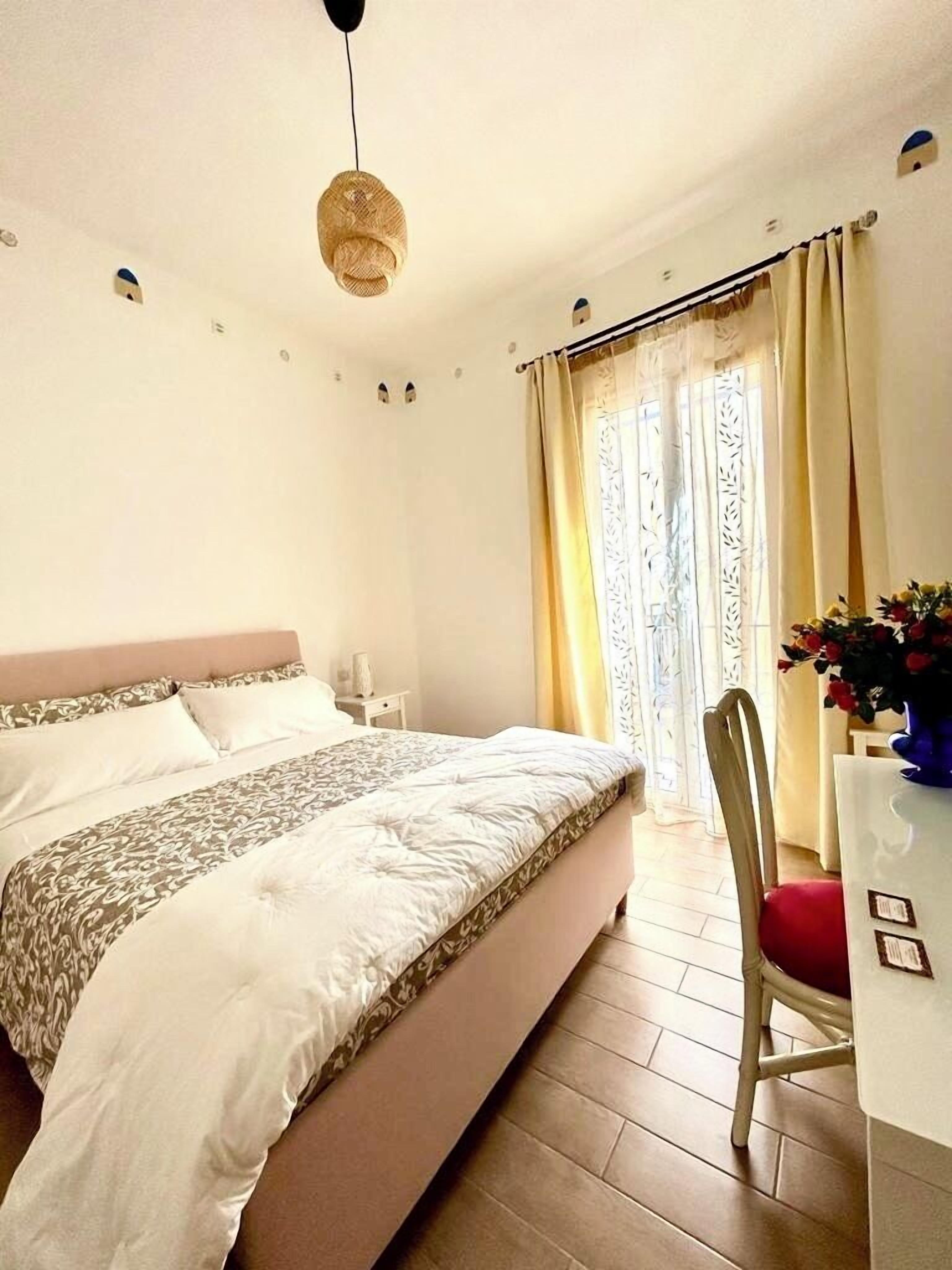 Deluxe Room, 1 Bedroom, Refrigerator, Courtyard Area | Minibar, in-room safe, individually decorated, desk