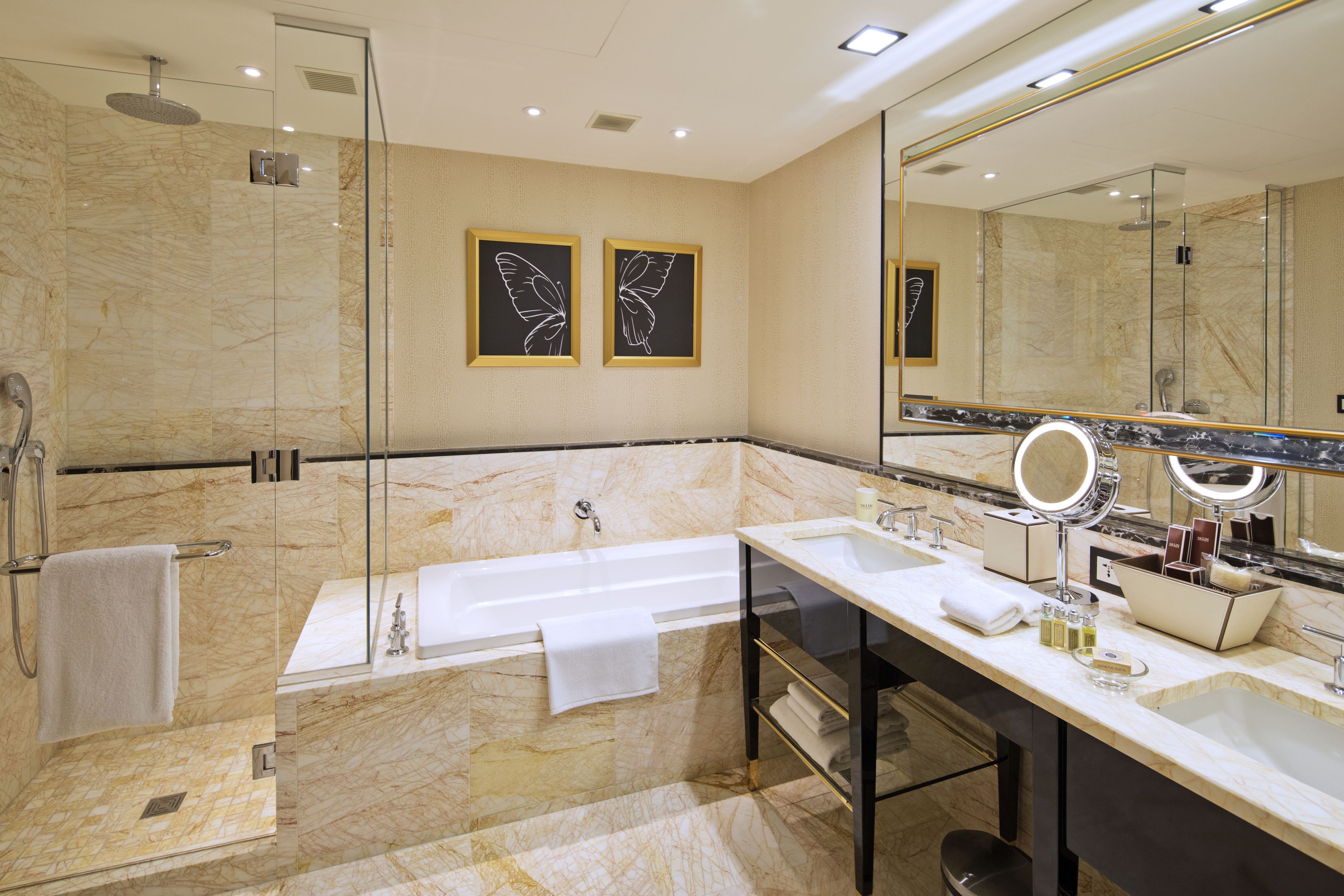 separate bathtub and shower, hair dryer, slippers, towels