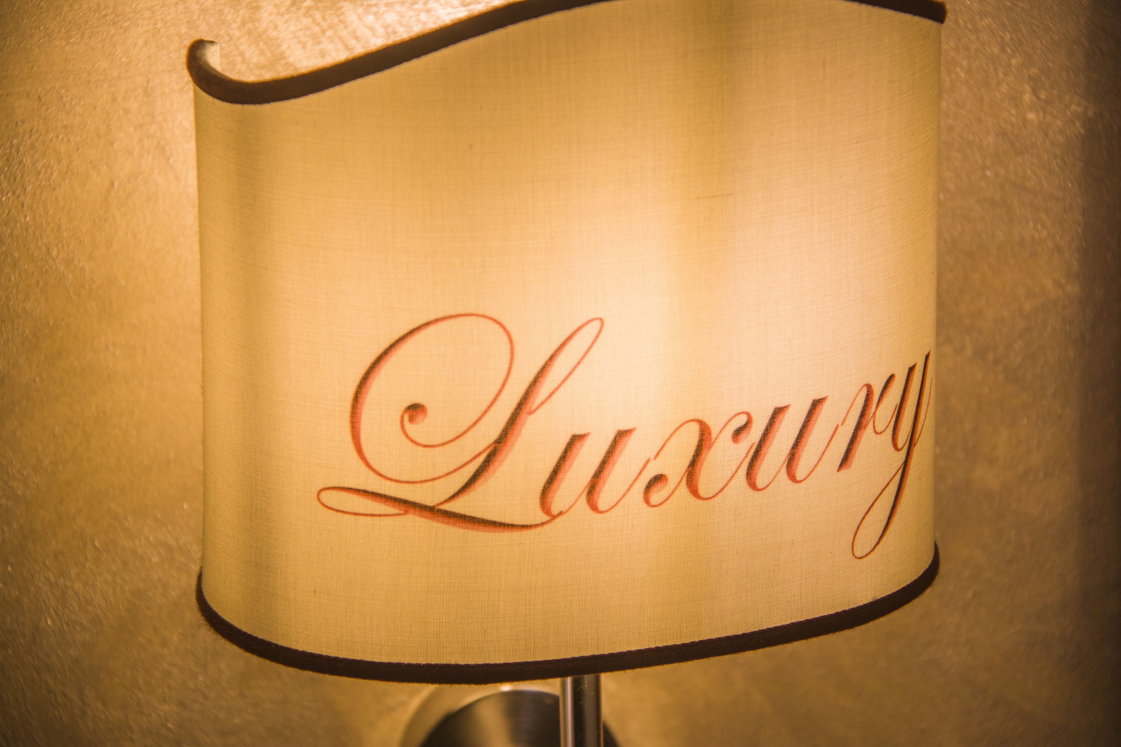 A lamp with the word "Luxury" written on it.