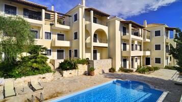 Seasonal outdoor pool, pool umbrellas, pool loungers