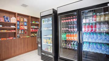 A vending area with snack options and a beverage dispenser.