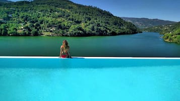 Indoor pool, seasonal outdoor pool, pool umbrellas, pool loungers
