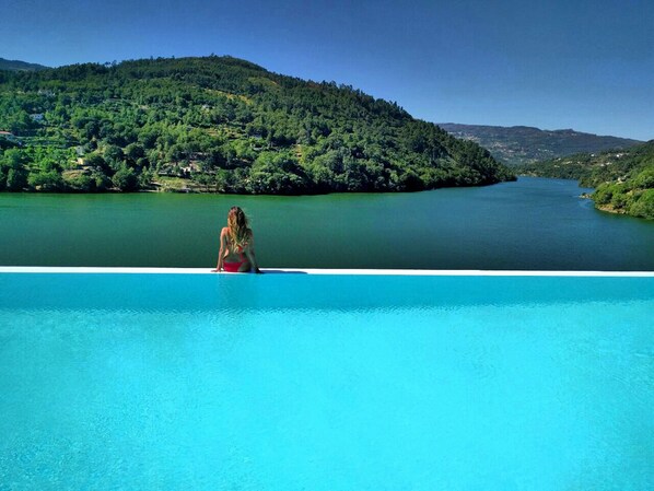 Indoor pool, seasonal outdoor pool, pool umbrellas, pool loungers