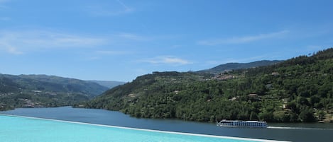 Indoor pool, seasonal outdoor pool, pool umbrellas, pool loungers