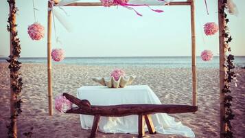 On the beach, white sand, free beach cabanas, beach towels
