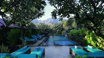 Outdoor pool, open 7:00 AM to 7:00 PM, pool umbrellas, pool loungers