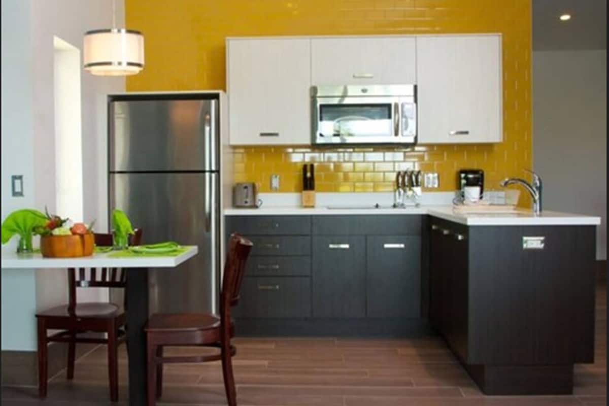 deluxe studio room | private kitchen | full-sized fridge, microwave, stovetop, coffee/tea maker