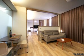 Exclusive Quadruple Room, Multiple Beds | Living area | LED TV, foosball, table tennis