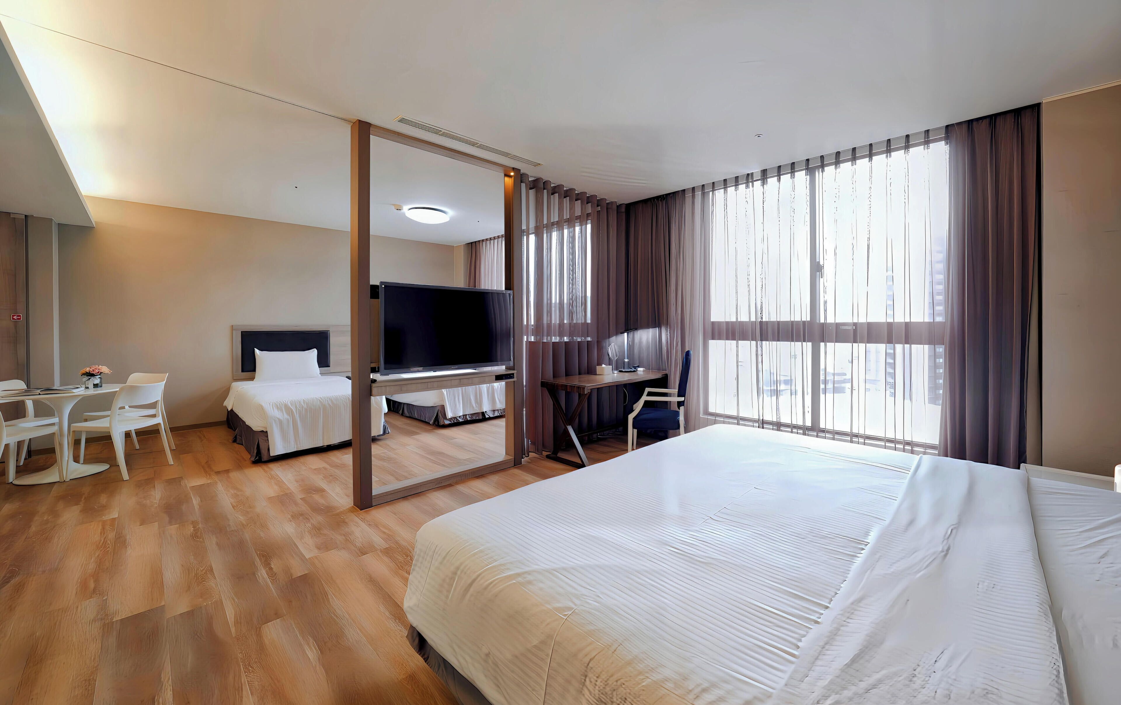 Deluxe Quadruple Room | Premium bedding, down comforters, in-room safe, desk