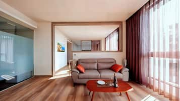 Exclusive Quadruple Room, Multiple Beds | Living area | LED TV, foosball, table tennis