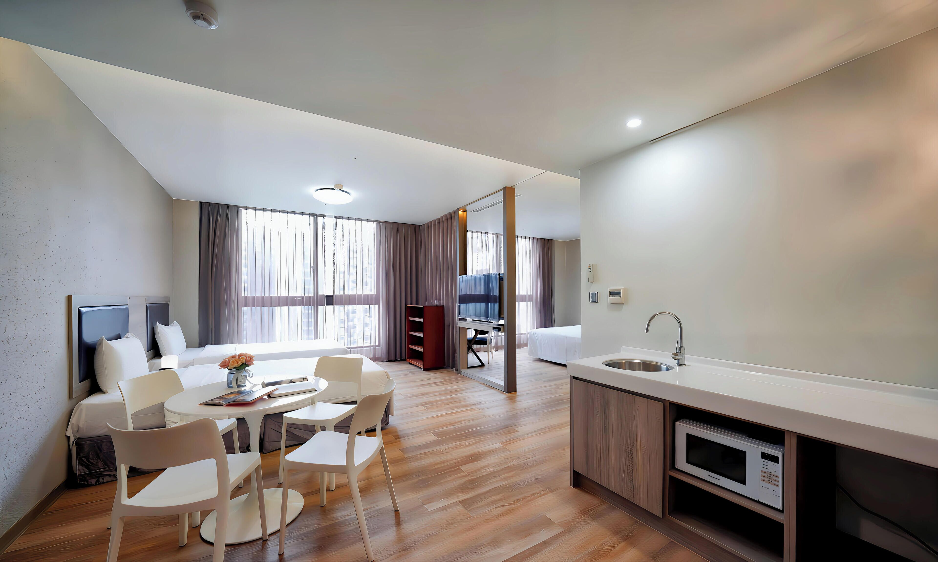 Deluxe Quadruple Room | Premium bedding, down comforters, in-room safe, desk