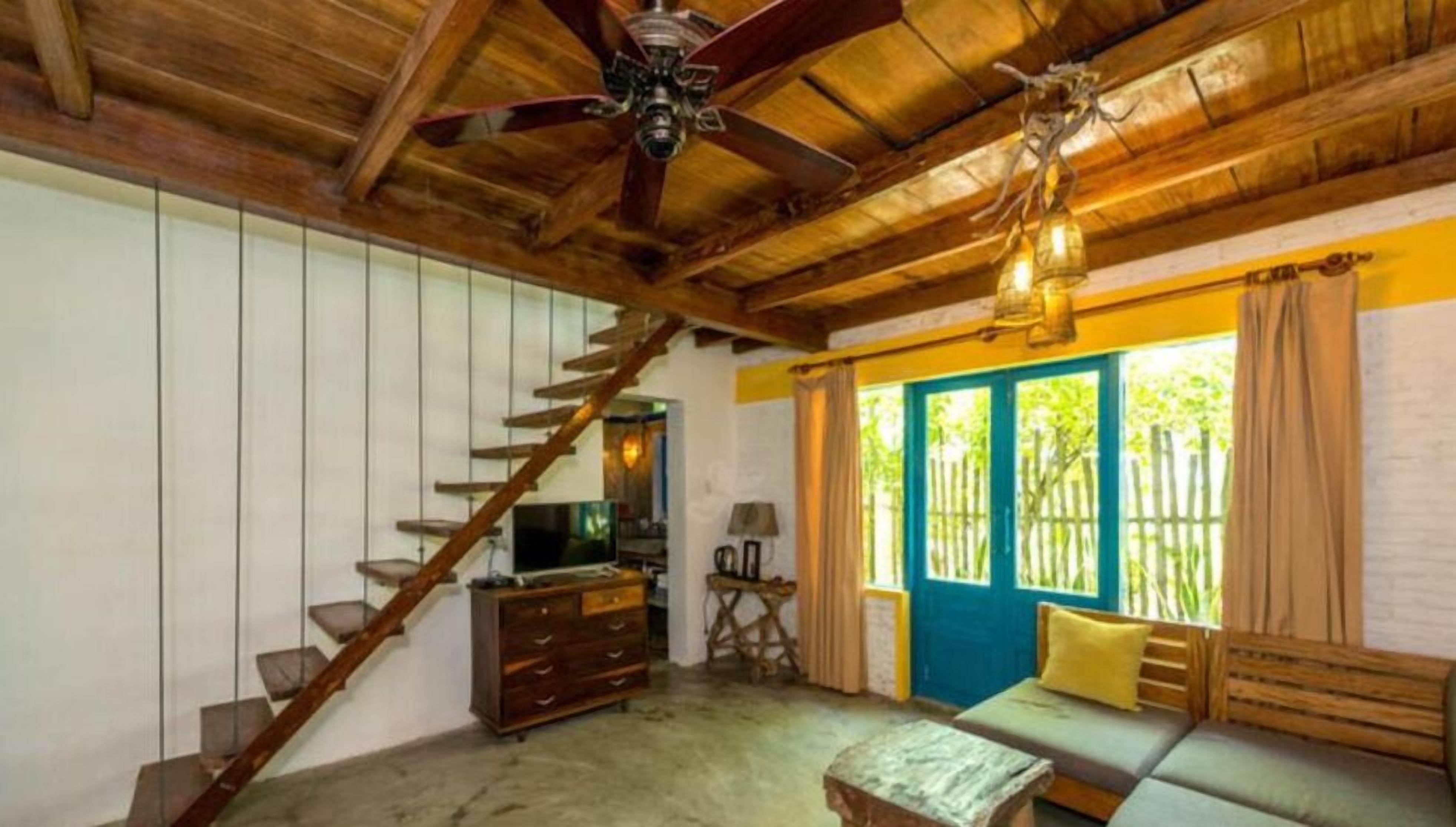 villa, beachfront | living room | flat-screen tv