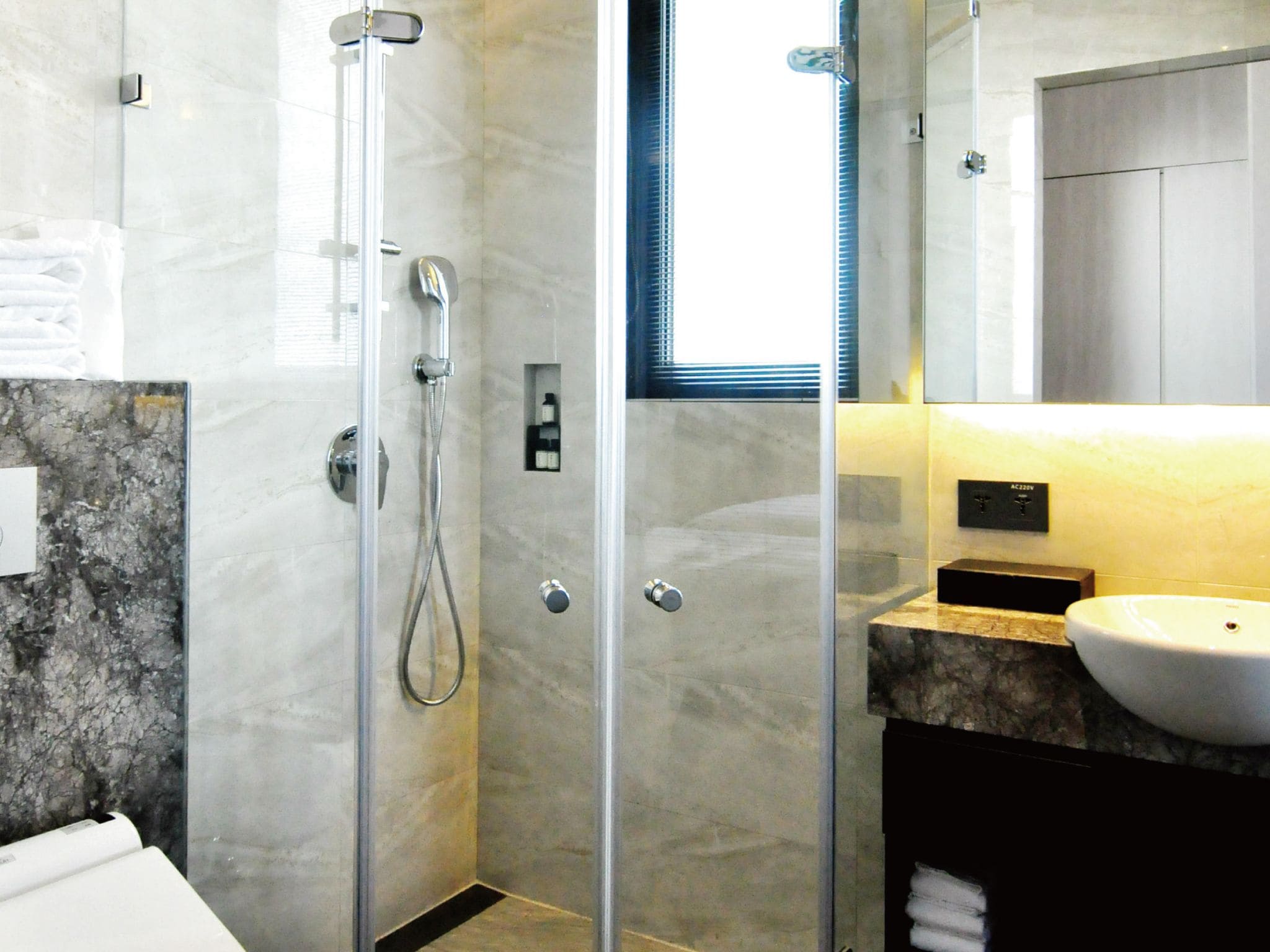 shower, hydromassage showerhead, designer toiletries, hair dryer