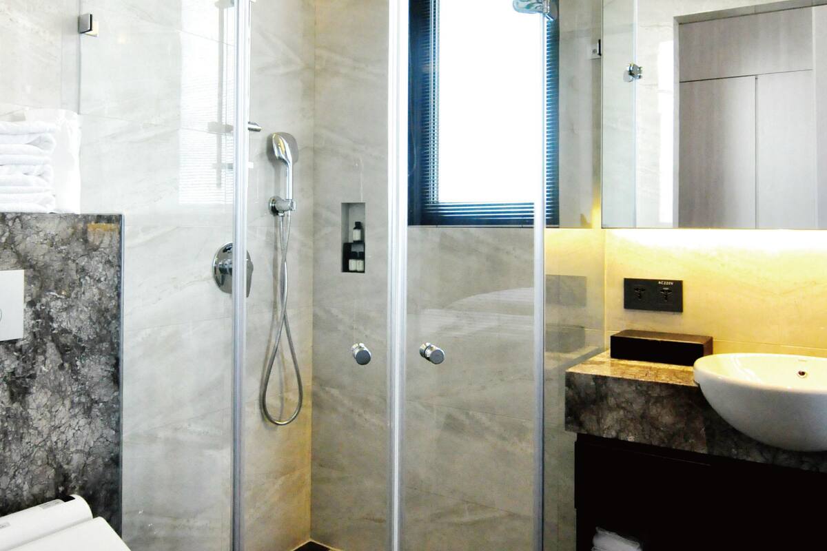 shower, hydromassage showerhead, designer toiletries, hair dryer