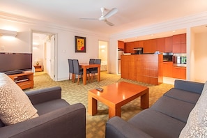 Deluxe Apartment, 2 Bedrooms | Living area | 32-inch TV with cable channels