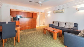 Deluxe Apartment, 2 Bedrooms | Living area | 32-inch TV with cable channels