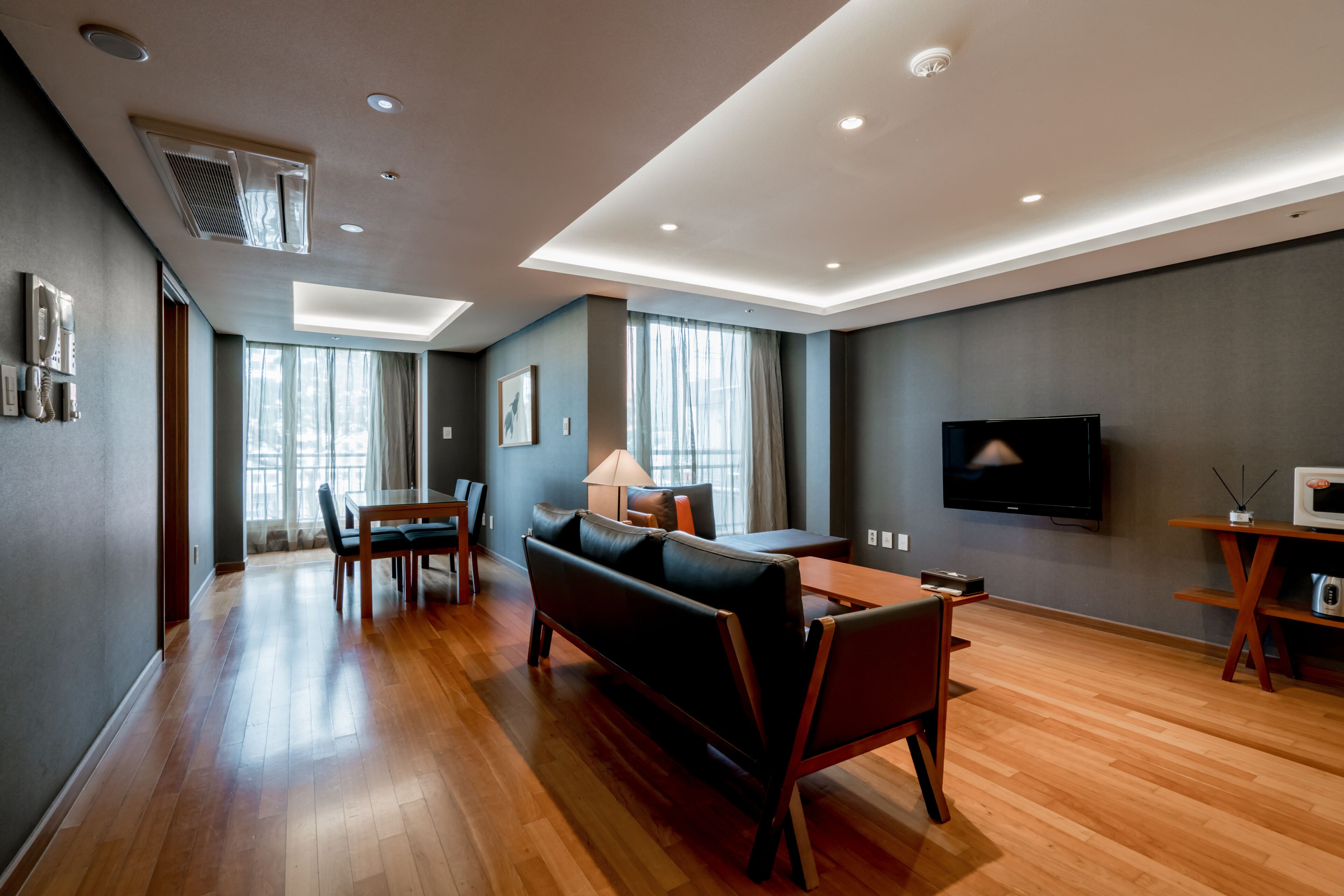 Deluxe Suite, 2 Bedrooms | Living area | LED TV