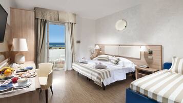 Standard Triple Room, Sea View | Minibar, in-room safe, desk, free WiFi