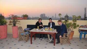Enjoy a meal or drinks on the rooftop terrace with a city view.