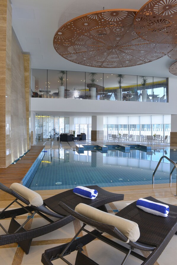 Indoor pool, pool loungers, lifeguards on site