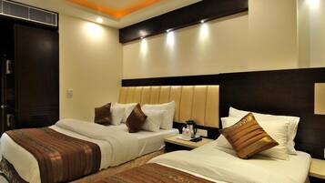 Executive Triple Room | Premium bedding, desk, laptop workspace, blackout curtains