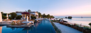 Outdoor pool, an infinity pool, free cabanas, pool umbrellas