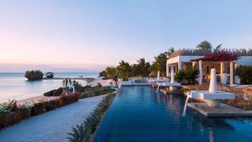 Outdoor pool, an infinity pool, free cabanas, pool umbrellas