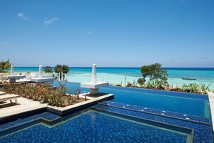 Outdoor pool, an infinity pool, free cabanas, pool umbrellas