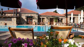 Indoor pool, outdoor pool, pool umbrellas, pool loungers