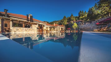 Indoor pool, outdoor pool, pool umbrellas, pool loungers