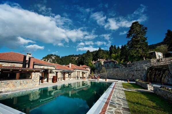 Indoor pool, outdoor pool, pool umbrellas, pool loungers