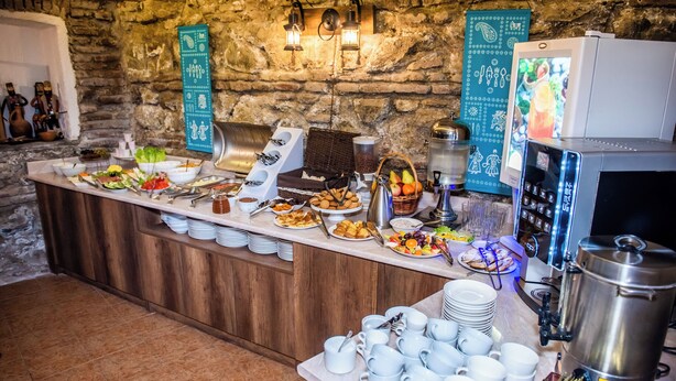 A buffet setup with various food items and a coffee station. - City Inn - Boutique Hotel Tbilisi (Tbilisi)