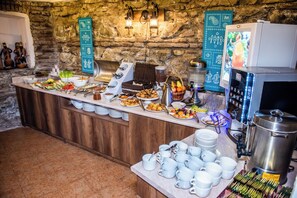 A buffet setup with various food items and a coffee station. - City Inn - Boutique Hotel Tbilisi (Tbilisi)