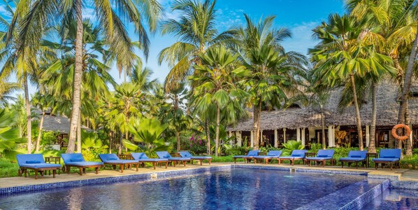 Indoor pool, outdoor pool, pool umbrellas, pool loungers