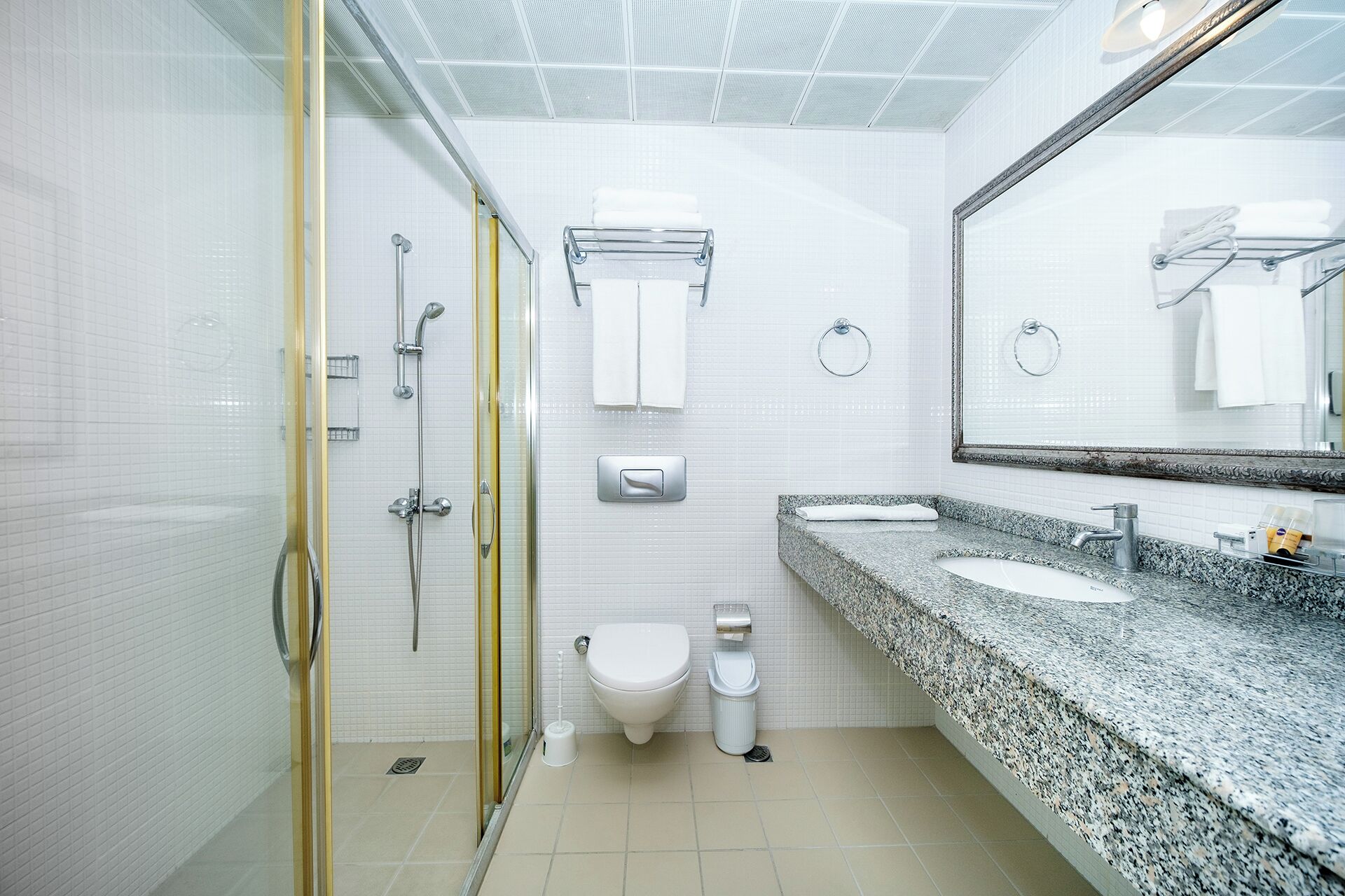 shower, hair dryer, slippers, towels