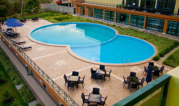 Outdoor pool, open 8 AM to 6 PM, pool umbrellas, pool loungers