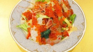 A plate with seafood and vegetables.