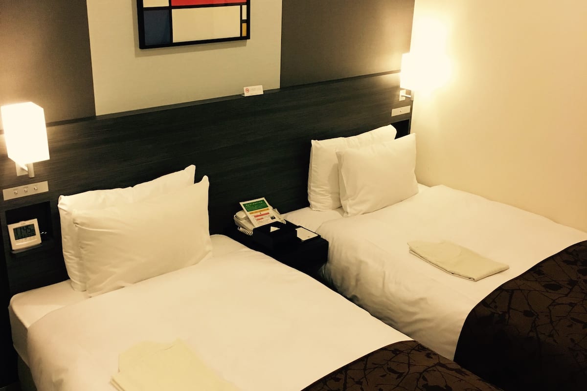 economy twin room, 2 single beds, smoking | in-room safe, desk, blackout curtains, iron/ironing board